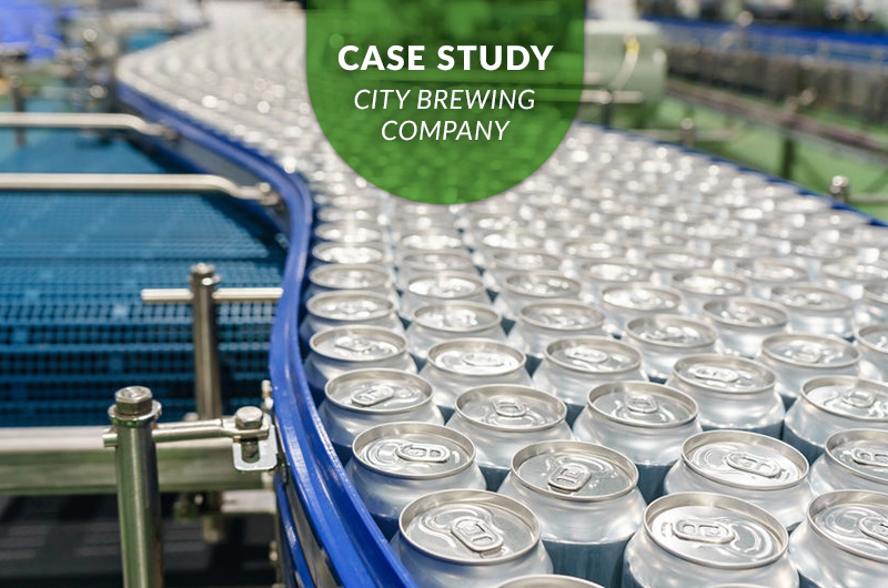 Conveyor line of aluminum cans at City Brewing Company, featured in a case study highlighting brewery waste management solutions implemented by iSustain.